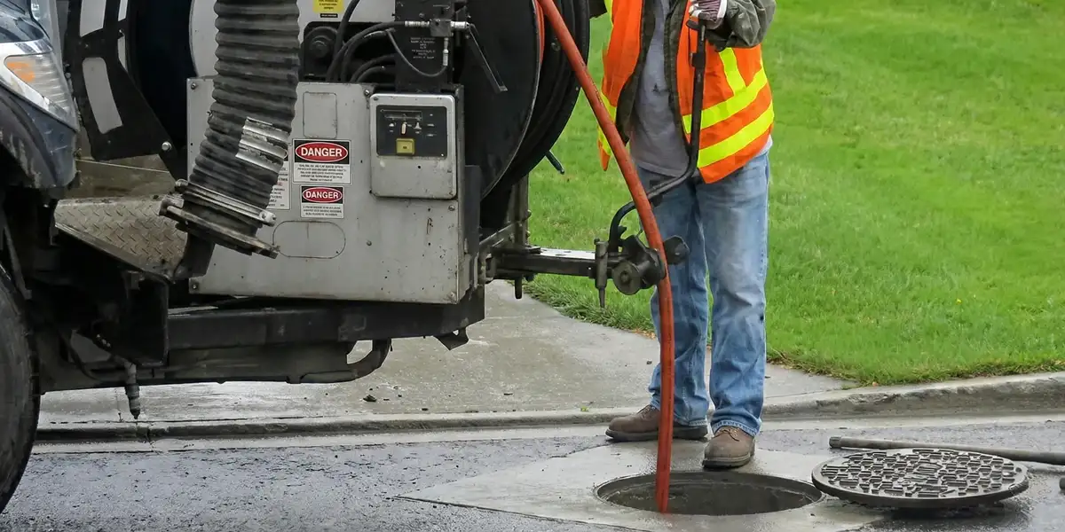sewage clean up professionals using industrial equipment to remove contaminated wastewater in Glendale, AZ