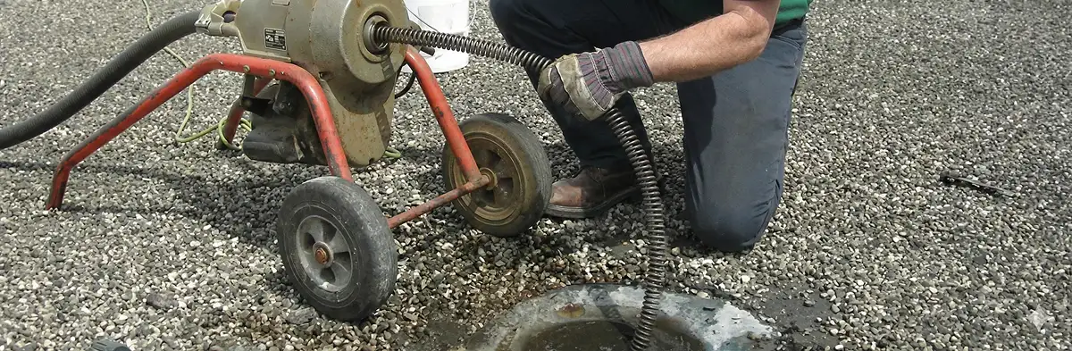 sewer rodding technician actively removing blockages from a sewer line in Glendale, AZ