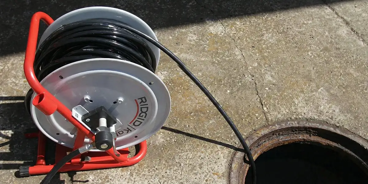 sewer rodding equipment prepared to clear clogged sewer lines in Glendale, AZ